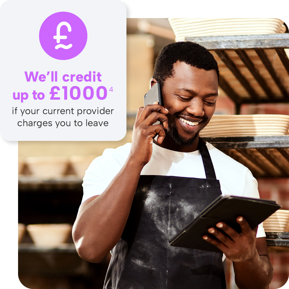Man in apron using tablet and phone, smiling. Text: "We’ll credit up to £1000 if your current provider charges you to leave."